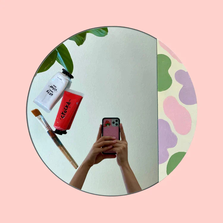 A finished design of a painted round mirror using Crockd's acrylic paint set