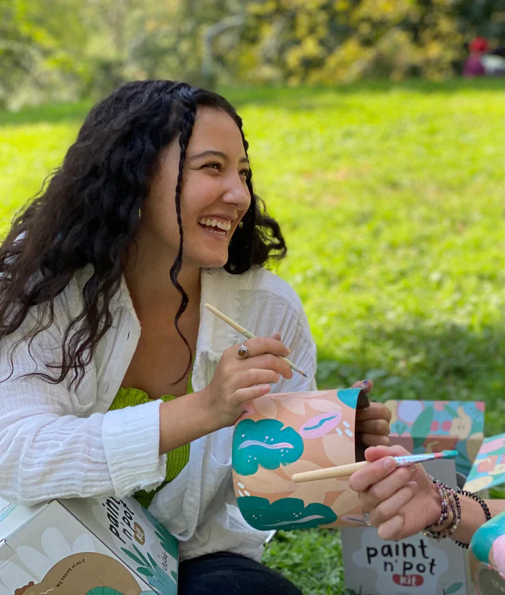 Woman enjoying painting in the park with Crockd kits