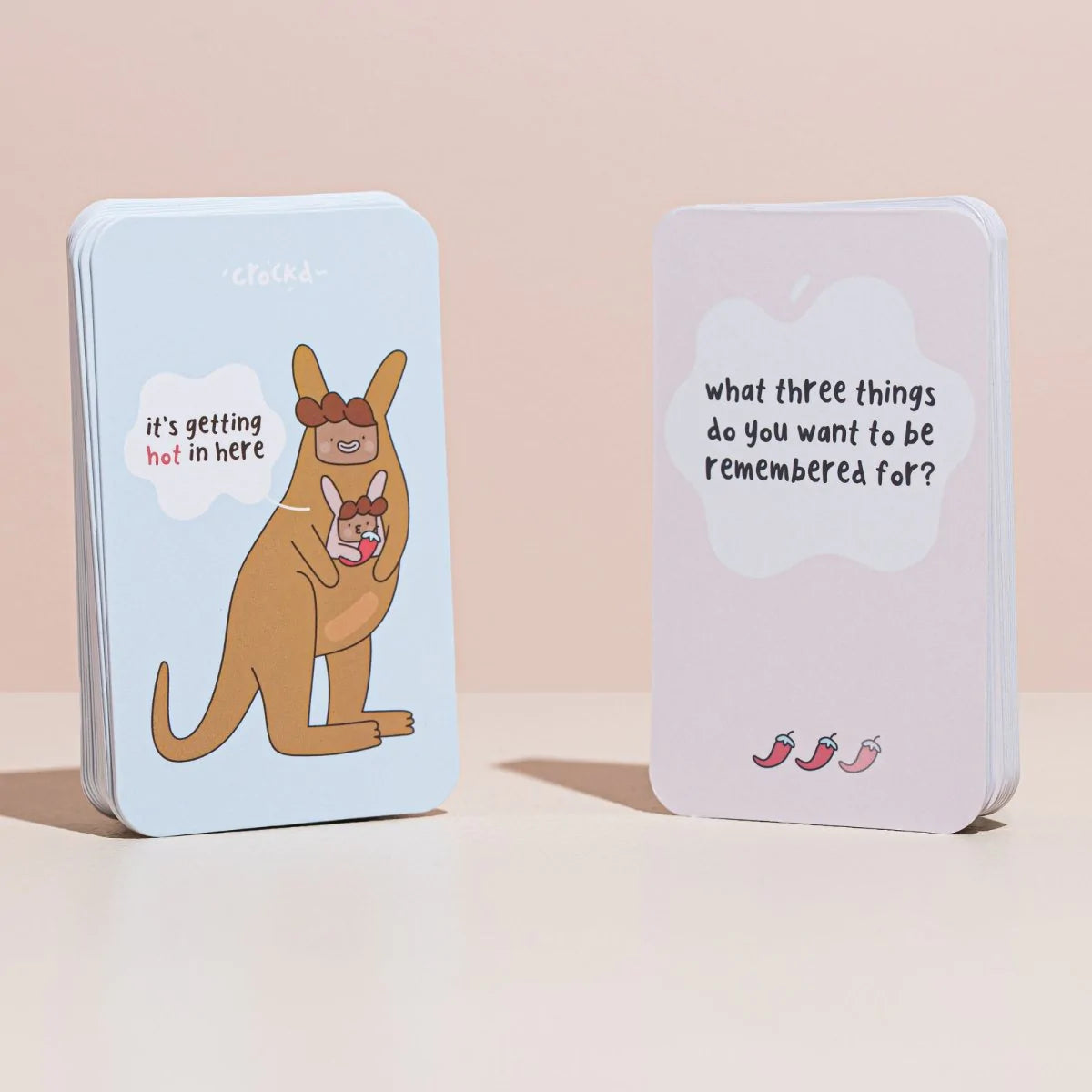 Another front and back product shot of the adult card game question cards