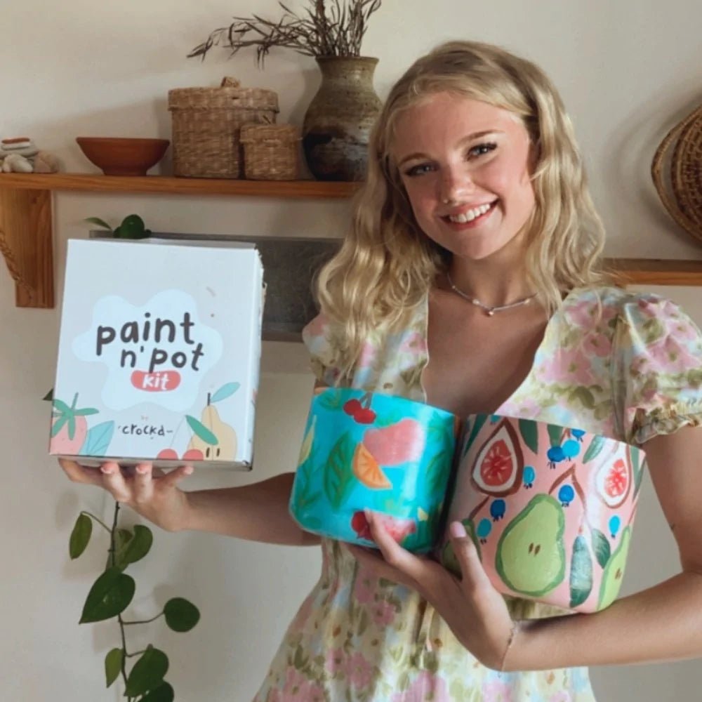 Crafter holding Crockd Paint n’ Pot DIY Painted Planters